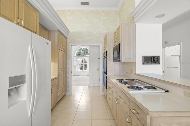 8 Dominica Dr, Englewood, FL 34223 - kitchen with black appliances, light countertops, light brown cabinets, light tile patterned flooring, and crown molding