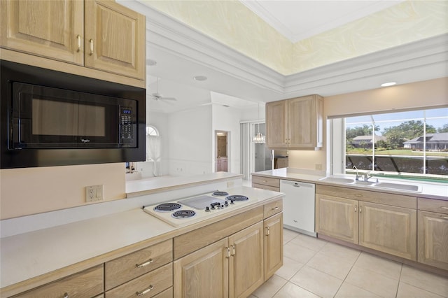 8 Dominica Dr, Englewood, FL 34223 - kitchen featuring white appliances, a sink, light brown cabinetry, light countertops, and light tile patterned flooring