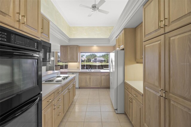 8 Dominica Dr, Englewood, FL 34223 - kitchen featuring black appliances, a ceiling fan, light countertops, light tile patterned floors, and a raised ceiling