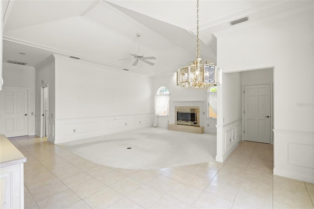 8 Dominica Dr, Englewood, FL 34223 - unfurnished living room featuring a decorative wall, light tile patterned flooring, ornamental molding, a chandelier, and a ceiling fan