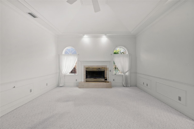 8 Dominica Dr, Englewood, FL 34223 - unfurnished living room featuring ornamental molding, a fireplace with raised hearth, a ceiling fan, a decorative wall, and plenty of natural light