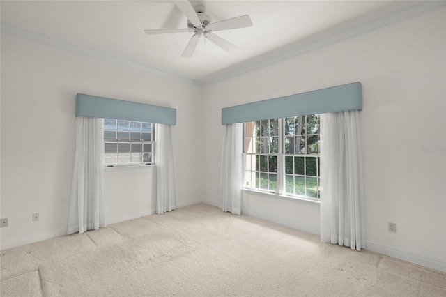 8 Dominica Dr, Englewood, FL 34223 - carpeted empty room featuring healthy amount of natural light, a ceiling fan, baseboards, and crown molding