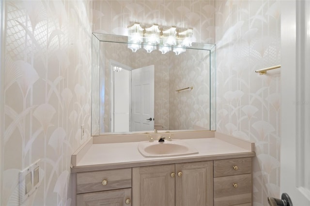 8 Dominica Dr, Englewood, FL 34223 - bathroom featuring wallpapered walls and vanity