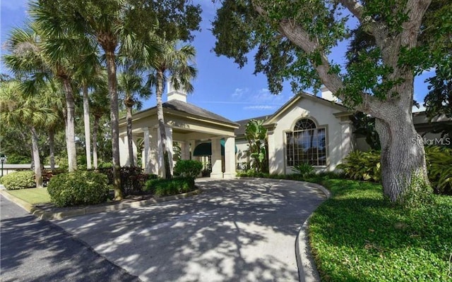8 Dominica Dr, Englewood, FL 34223 - view of front of property featuring stucco siding and driveway