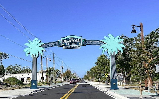 8 Dominica Dr, Englewood, FL 34223 - view of asphalt street featuring sidewalks, street lighting, and curbs