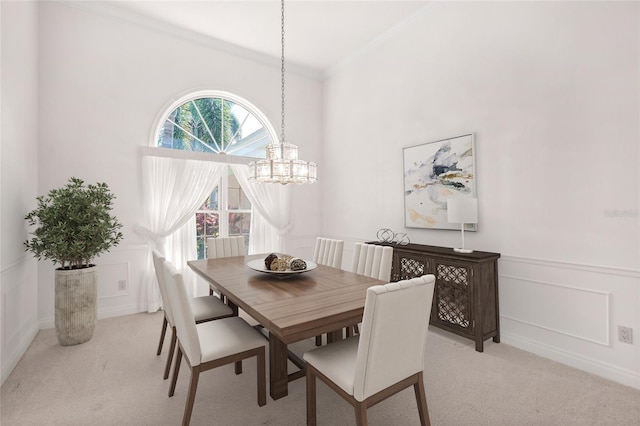 8 Dominica Dr, Englewood, FL 34223 - carpeted dining room with a chandelier, crown molding, a decorative wall, and a wainscoted wall