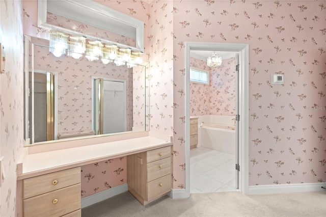 8 Dominica Dr, Englewood, FL 34223 - bathroom with wallpapered walls, a garden tub, baseboards, and vanity