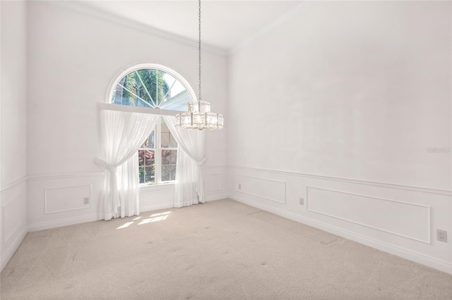 8 Dominica Dr, Englewood, FL 34223 - unfurnished dining area with crown molding, a decorative wall, a chandelier, carpet floors, and wainscoting
