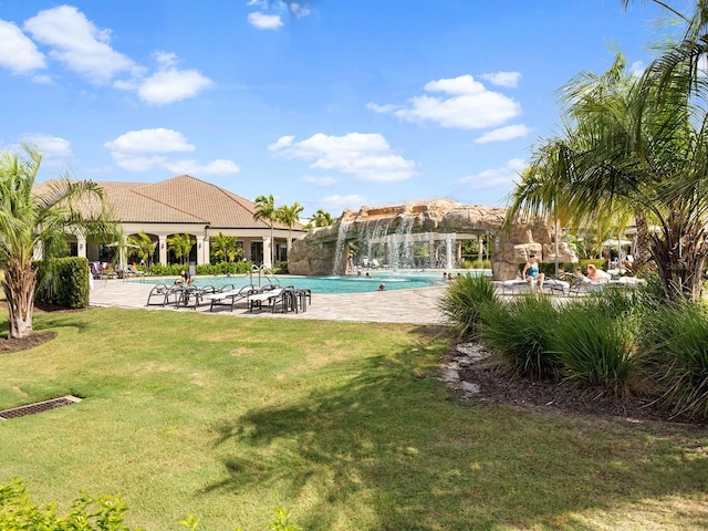 community pool with a lawn