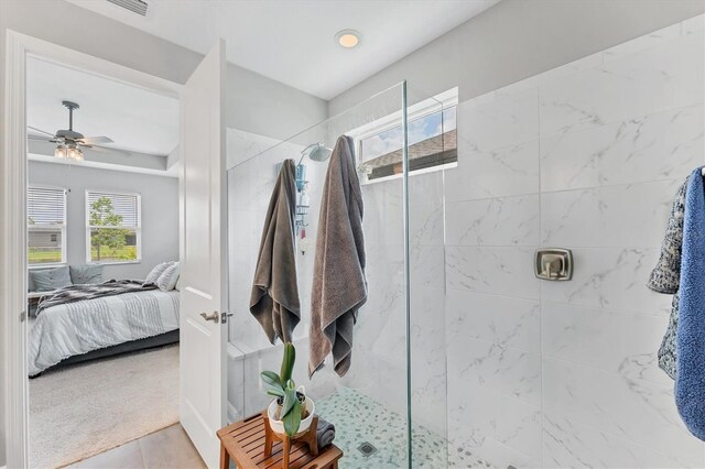 1017 Fernleaf Run, Bradenton, FL 34212 - bathroom featuring ensuite bathroom, walk in shower, ceiling fan, and tile patterned floors