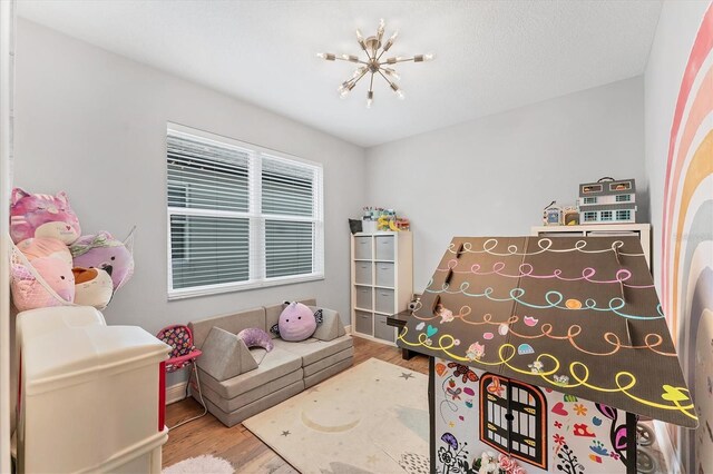 1017 Fernleaf Run, Bradenton, FL 34212 - playroom with wood finished floors and baseboards