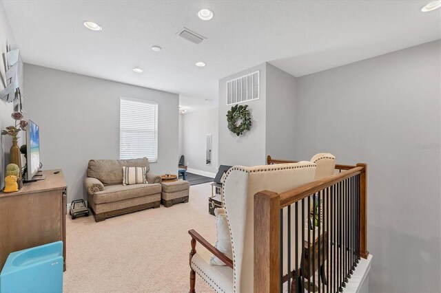 1017 Fernleaf Run, Bradenton, FL 34212 - carpeted living room featuring recessed lighting