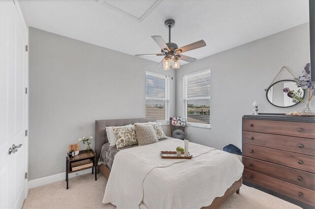1017 Fernleaf Run, Bradenton, FL 34212 - bedroom with light colored carpet, baseboards, and ceiling fan