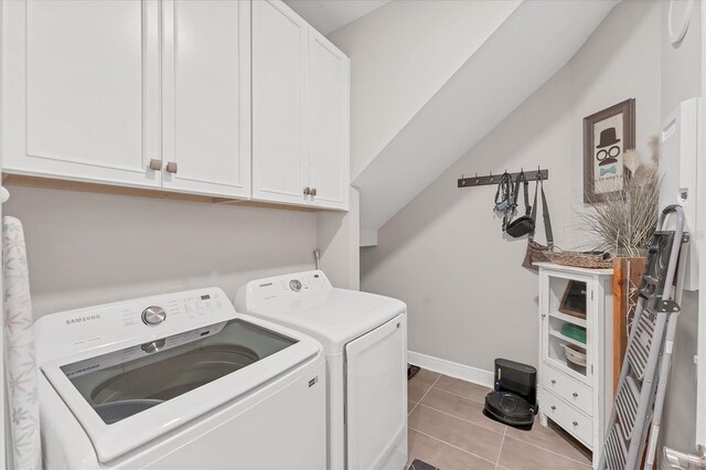 1017 Fernleaf Run, Bradenton, FL 34212 - laundry area with washing machine and dryer, cabinet space, tile patterned flooring, and baseboards