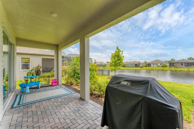 1017 Fernleaf Run, Bradenton, FL 34212 - view of patio with area for grilling, a water view, and a residential view