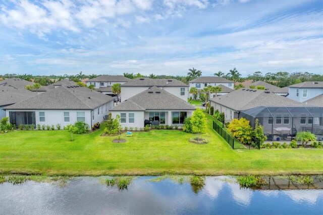 1017 Fernleaf Run, Bradenton, FL 34212 - rear view of property with a residential view and a water view
