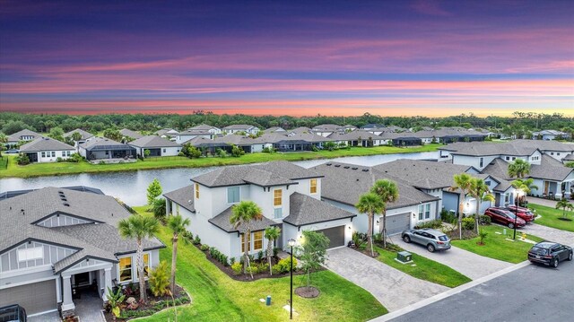 1017 Fernleaf Run, Bradenton, FL 34212 - aerial view at dusk of a residential view and a water view