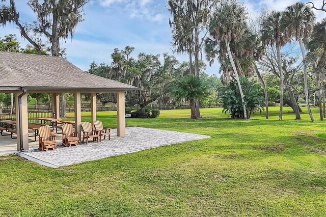 1017 Fernleaf Run, Bradenton, FL 34212 - view of grassy yard with a gazebo and a patio