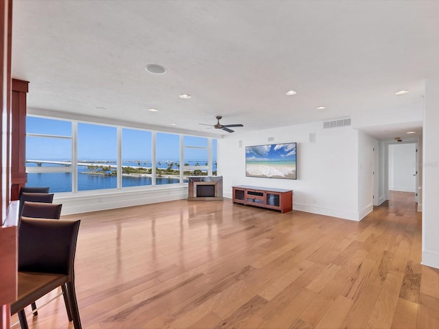 226 Golden Gate Pt Unit 63, Sarasota, FL 34236 - living room with light wood-style floors, a ceiling fan, recessed lighting, and baseboards