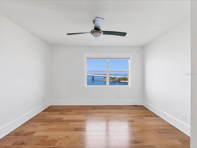 226 Golden Gate Pt Unit 63, Sarasota, FL 34236 - spare room featuring light wood-type flooring and baseboards