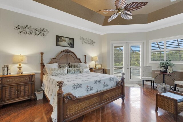 385 165th Ct NE, Bradenton, FL 34212 - bedroom with access to exterior, wood finished floors, a raised ceiling, and ceiling fan