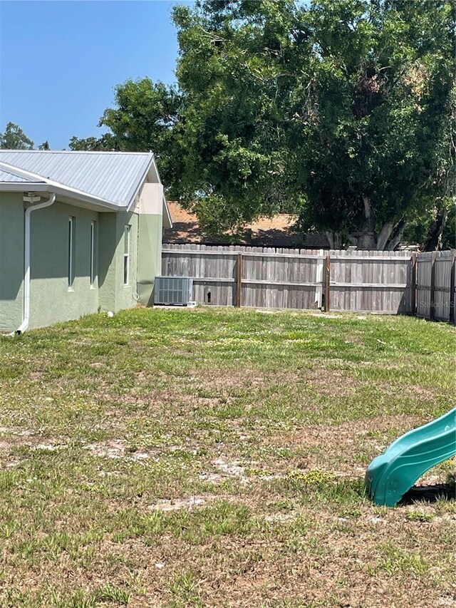 5094 Bunyan St, Sarasota, FL 34232 - view of yard featuring a playground and central AC unit