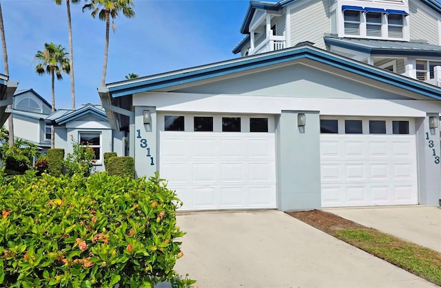 1311 Siesta Bayside Dr Unit 1311-A, Sarasota, FL 34242 - view of front of home with driveway and stucco siding