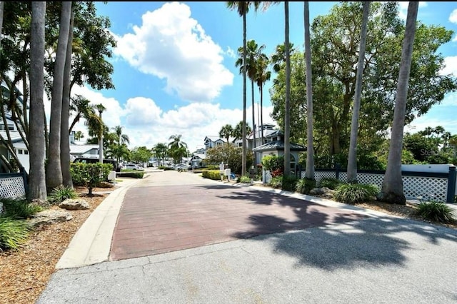 1311 Siesta Bayside Dr Unit 1311-A, Sarasota, FL 34242 - view of asphalt road with a residential view and curbs