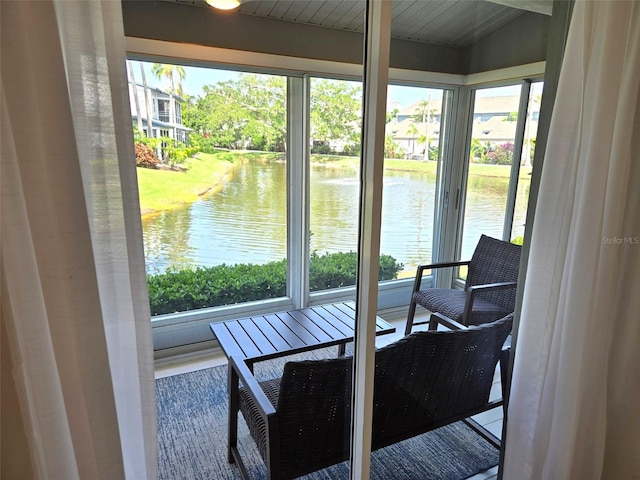 1311 Siesta Bayside Dr Unit 1311-A, Sarasota, FL 34242 - sunroom / solarium featuring a water view and plenty of natural light