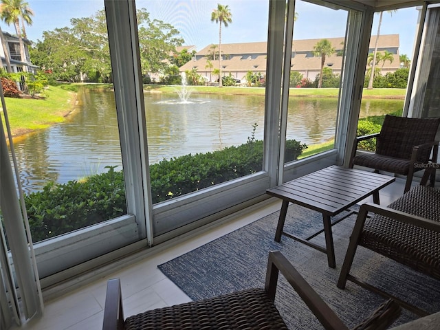1311 Siesta Bayside Dr Unit 1311-A, Sarasota, FL 34242 - sunroom / solarium featuring healthy amount of natural light and a water view