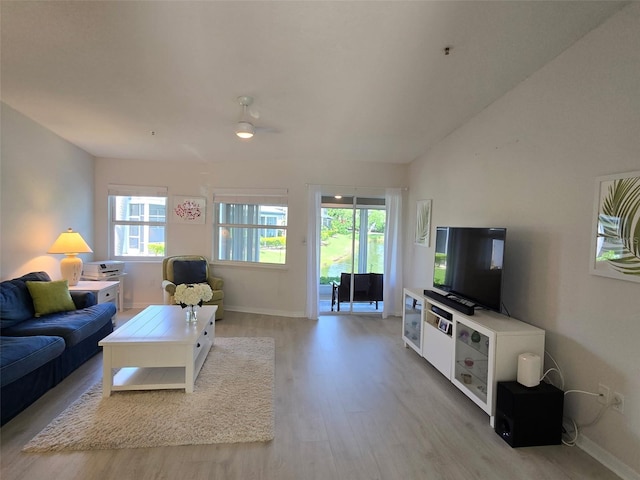 1311 Siesta Bayside Dr Unit 1311-A, Sarasota, FL 34242 - living area with light wood-style floors, baseboards, a ceiling fan, and lofted ceiling