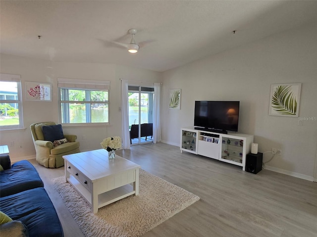 1311 Siesta Bayside Dr Unit 1311-A, Sarasota, FL 34242 - living area featuring wood finished floors, ceiling fan, and baseboards