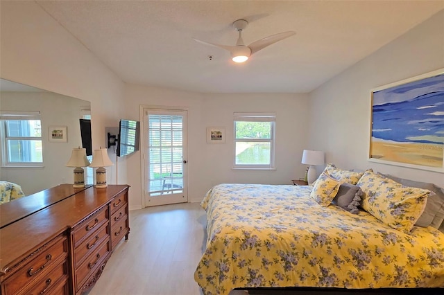1311 Siesta Bayside Dr Unit 1311-A, Sarasota, FL 34242 - bedroom featuring access to outside, light wood-style flooring, and a ceiling fan