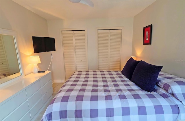 1311 Siesta Bayside Dr Unit 1311-A, Sarasota, FL 34242 - bedroom featuring multiple closets and a ceiling fan