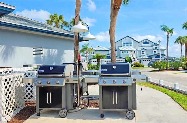 1311 Siesta Bayside Dr Unit 1311-A, Sarasota, FL 34242 - view of patio with grilling area and a residential view