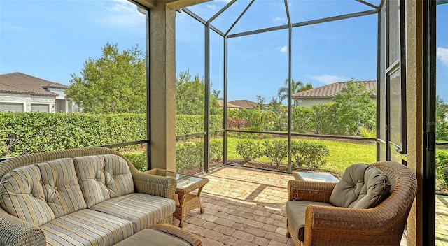 sunroom featuring an outdoor living space