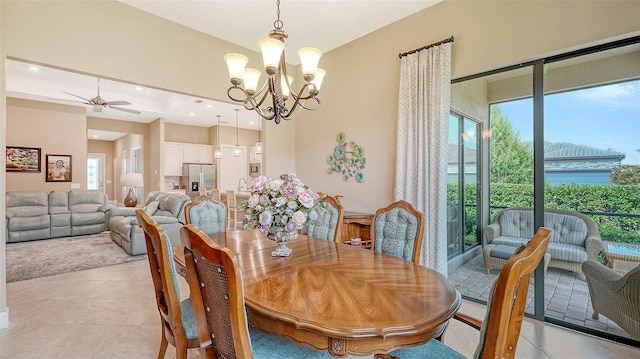 dining room with ceiling fan, plenty of natural light, a chandelier, light tile patterned floors, and recessed lighting