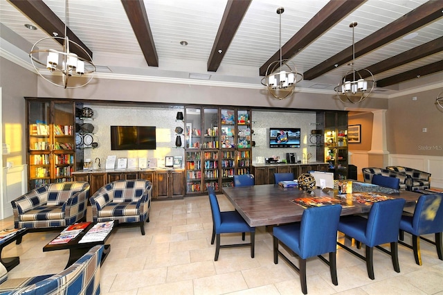 dining room featuring a chandelier and beamed ceiling