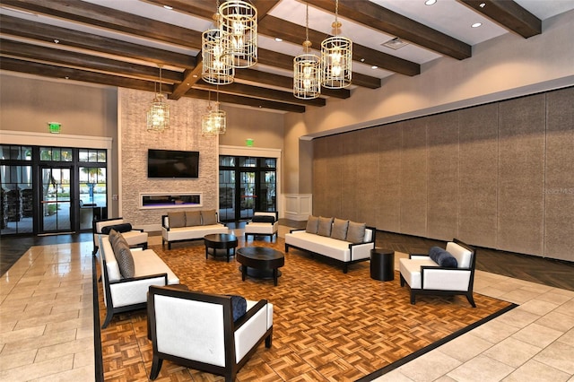 lobby with a towering ceiling, beam ceiling, and recessed lighting