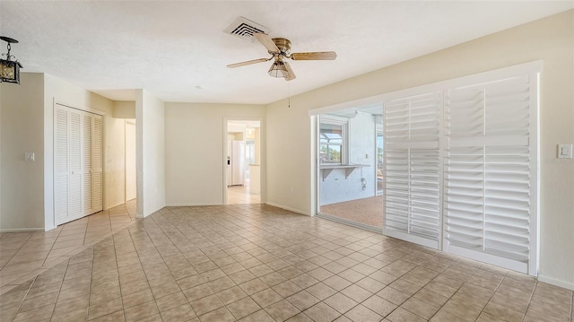 4361 Pompano Ln, Palmetto, FL 34221 - tiled spare room with a ceiling fan and baseboards
