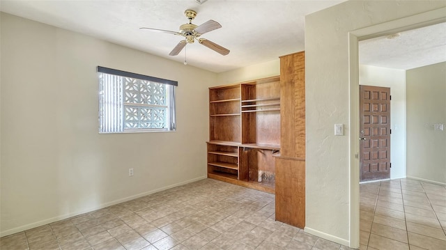 4361 Pompano Ln, Palmetto, FL 34221 - unfurnished bedroom with light tile patterned floors, baseboards, and ceiling fan