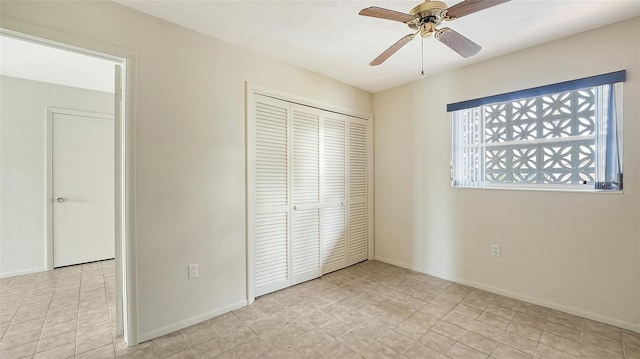 4361 Pompano Ln, Palmetto, FL 34221 - unfurnished bedroom featuring a closet, baseboards, and ceiling fan