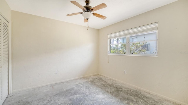 4361 Pompano Ln, Palmetto, FL 34221 - unfurnished bedroom with concrete floors, a closet, baseboards, and a ceiling fan