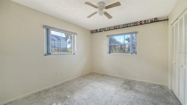 4361 Pompano Ln, Palmetto, FL 34221 - unfurnished bedroom featuring multiple windows, baseboards, and a closet