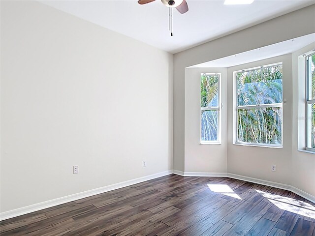 4239 Corso Venetia Blvd, Venice, FL 34293 - spare room with dark wood finished floors, ceiling fan, and baseboards