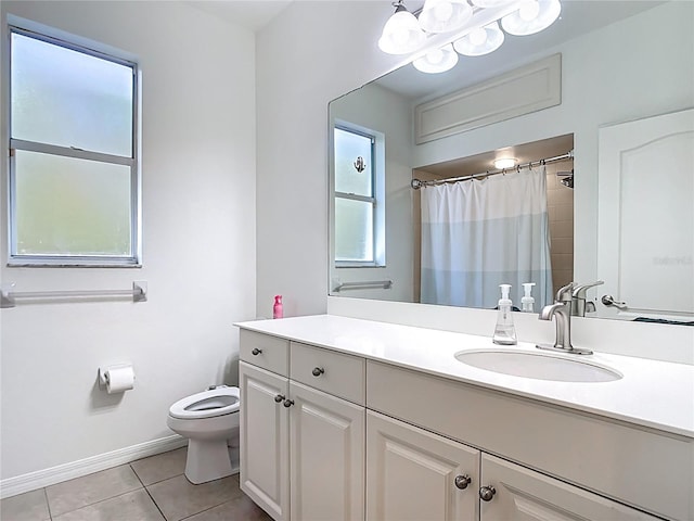 4239 Corso Venetia Blvd, Venice, FL 34293 - bathroom featuring tile patterned floors, toilet, vanity, curtained shower, and baseboards