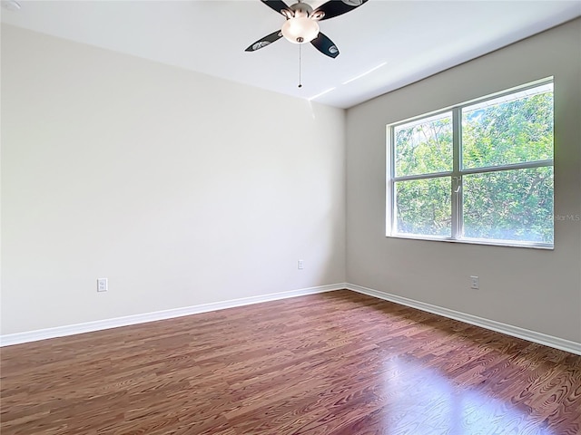 4239 Corso Venetia Blvd, Venice, FL 34293 - unfurnished room featuring dark wood-style floors, ceiling fan, and baseboards