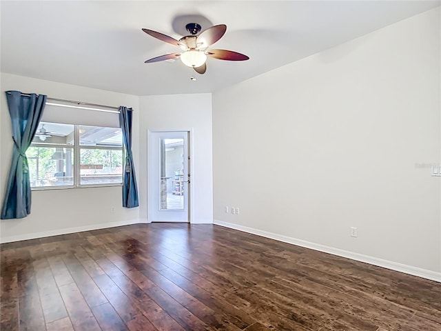4239 Corso Venetia Blvd, Venice, FL 34293 - spare room featuring a ceiling fan, dark wood-style floors, and baseboards