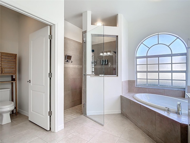 4239 Corso Venetia Blvd, Venice, FL 34293 - full bath with a garden tub, walk in shower, tile patterned flooring, baseboards, and toilet