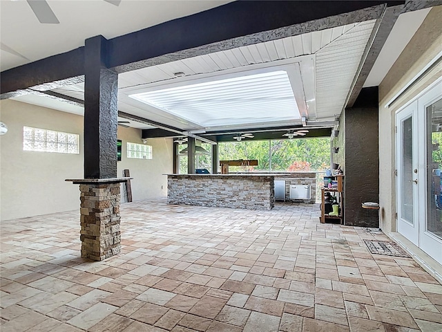 4239 Corso Venetia Blvd, Venice, FL 34293 - view of patio featuring french doors, exterior kitchen, and ceiling fan